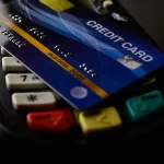 credit card sitting on top of a card reader