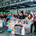 Group photo of people with shopping carts